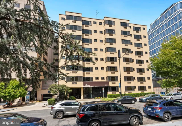 a view of a car parked in front of a building