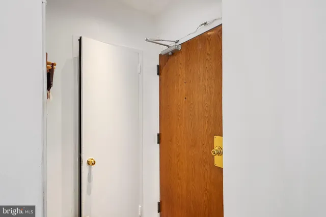 a bathroom with a shower and a door