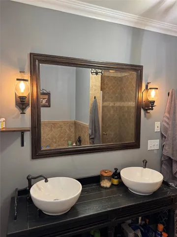 a bathroom with a sink and a mirror