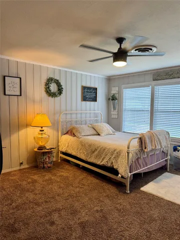a bedroom with a bed and a cabinets