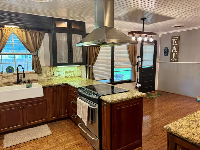 a kitchen with a stove and a sink