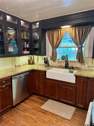 a kitchen with a sink and a large window