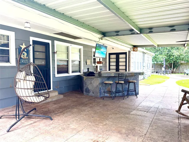 a view of a kitchen with a dining table and chairs