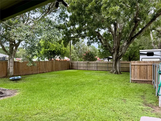 a view of a backyard with a small cabin