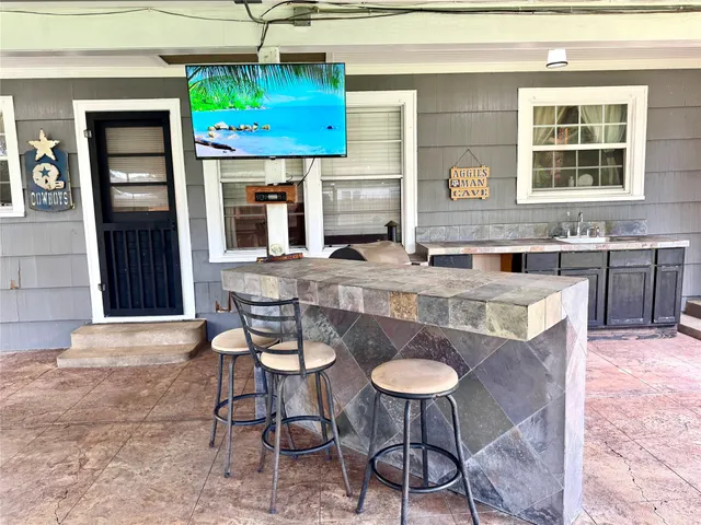 a kitchen with a stove a sink and a refrigerator