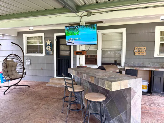 a kitchen with a table and chairs in it