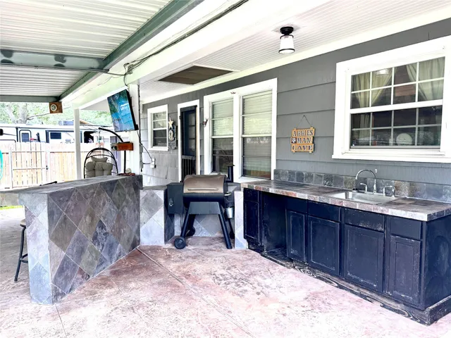 a room with wooden cabinets and a sink