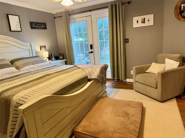 a bedroom with bed and a couch