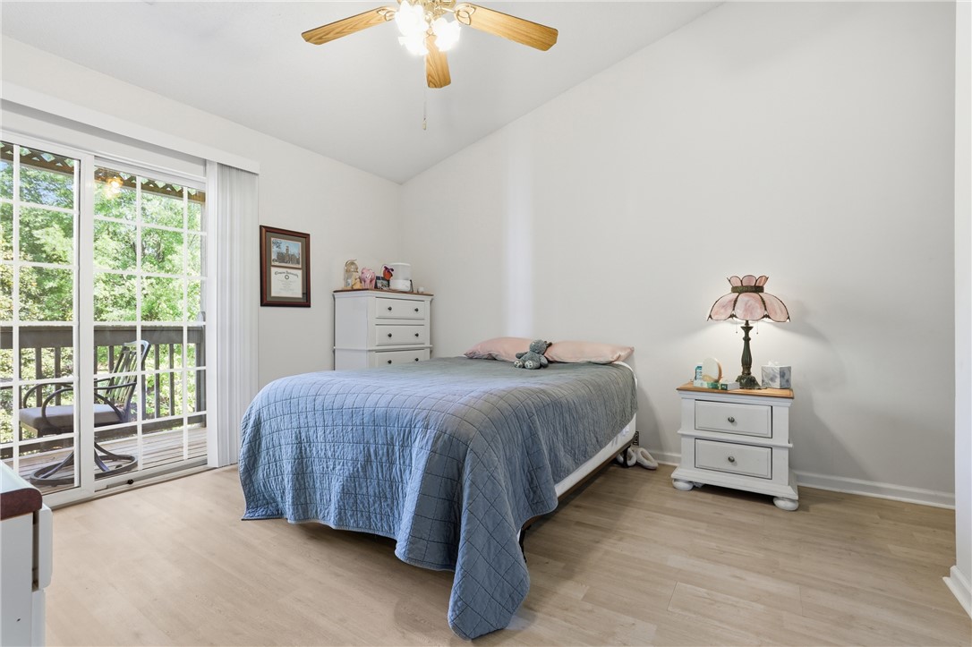 131 Wexford Drive Anderson, SC 29621 - Photo 15 of 25 This bright bedroom features a private balcony, offering a serene escape.