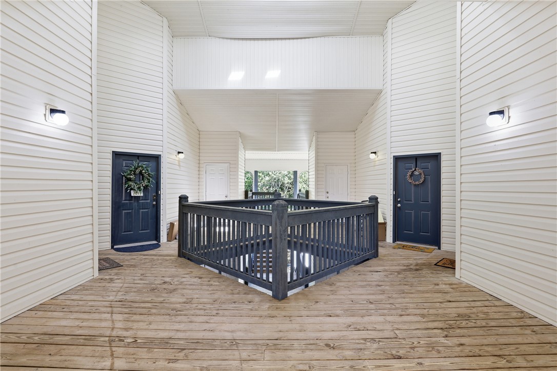 131 Wexford Drive Anderson, SC 29621 - Photo 2 of 25 This outdoor hallway provides access to multiple units with classic wood flooring and durable siding.