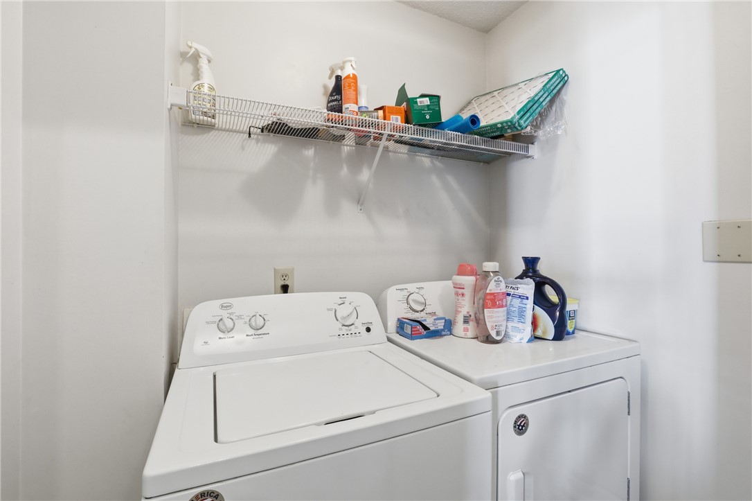 131 Wexford Drive Anderson, SC 29621 - Photo 20 of 25 This functional laundry area features essential appliances and convenient shelving for storage.