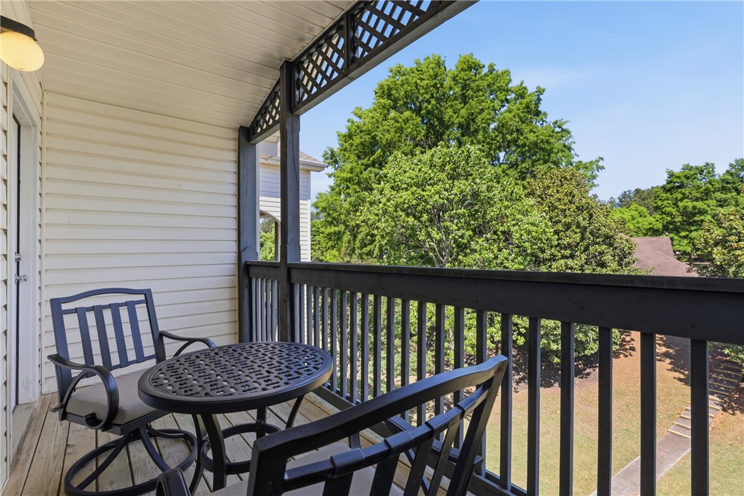131 Wexford Drive Anderson, SC 29621 - Photo 22 of 25 This cozy balcony offers a tranquil retreat with refreshing tree-lined views.