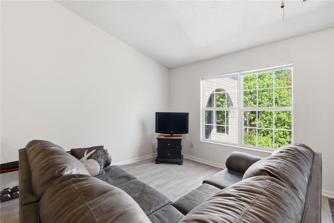 131 Wexford Drive Anderson, SC 29621 - Photo 4 of 25 This bright living space offers comfort and expansive views through its large windows.