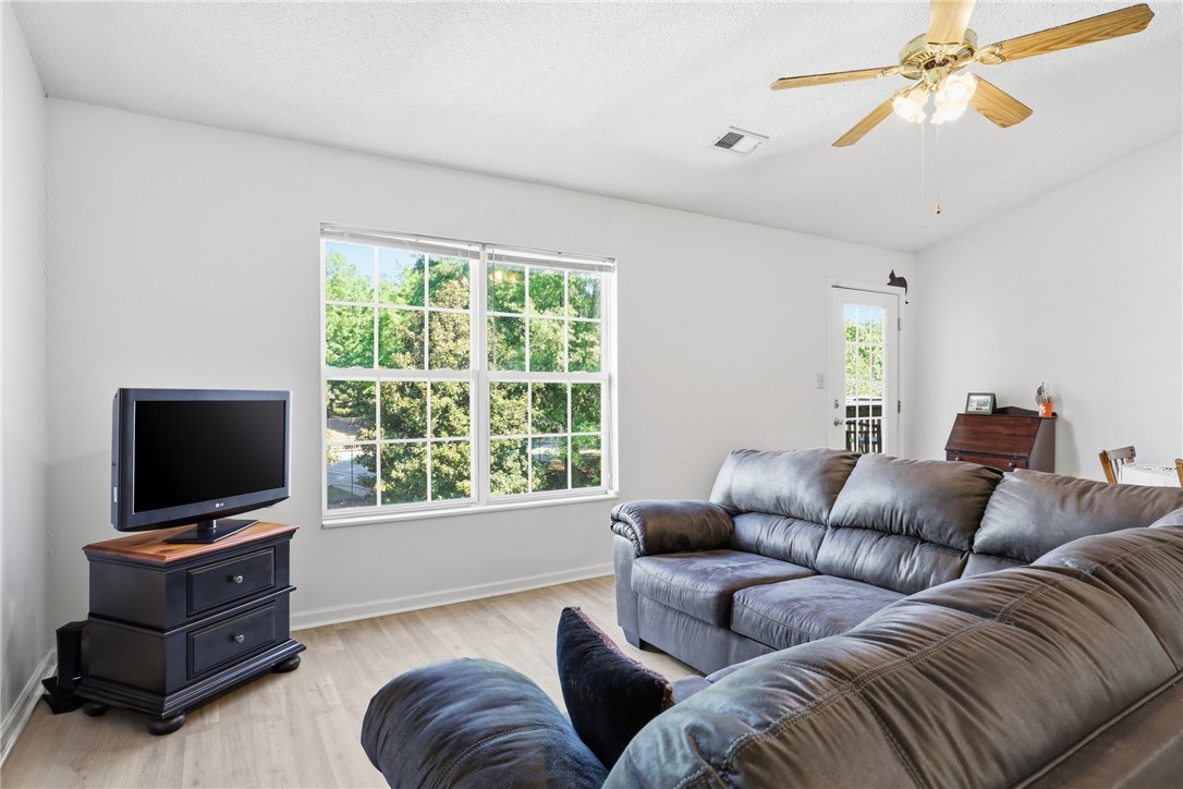 131 Wexford Drive Anderson, SC 29621 - Photo 5 of 25 Bright and airy living area featuring a large window and wood-look flooring.