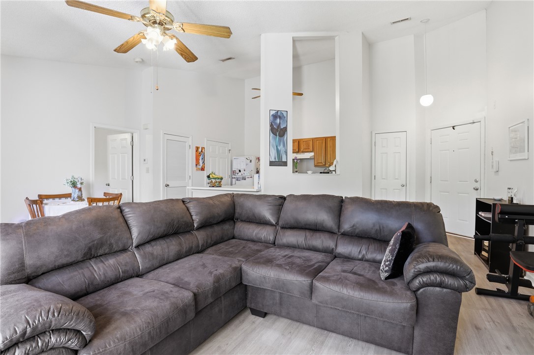 131 Wexford Drive Anderson, SC 29621 - Photo 6 of 25 This bright living space features high ceilings and a view of the adjacent kitchen and dining area.
