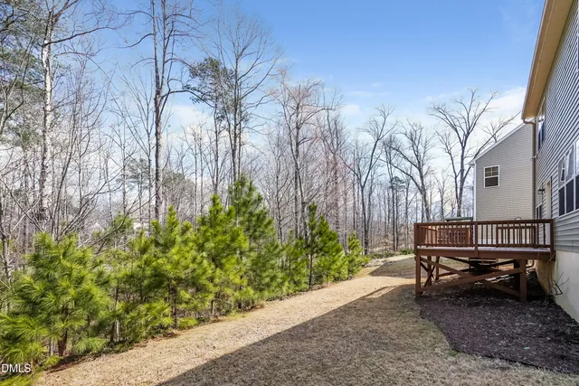 a wooden bench sitting in front of a building