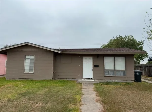 a house with yard in front of it