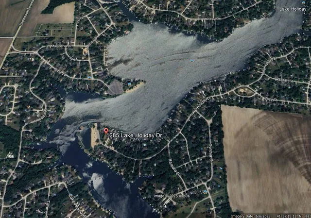 a view of water heater and covered with wooden fence