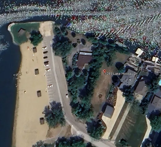 an aerial view of a house with outdoor space