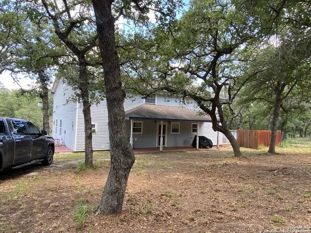 a house view with a backyard space