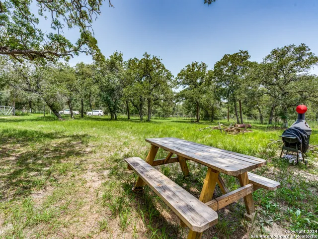 a view of a two chairs in a yard