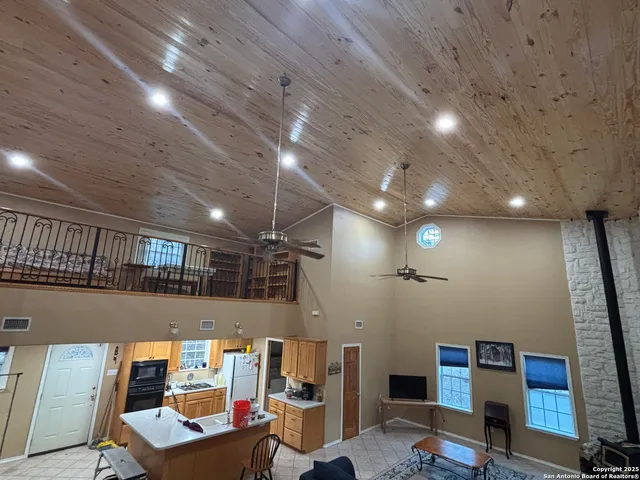 a room with furniture and a projector screen