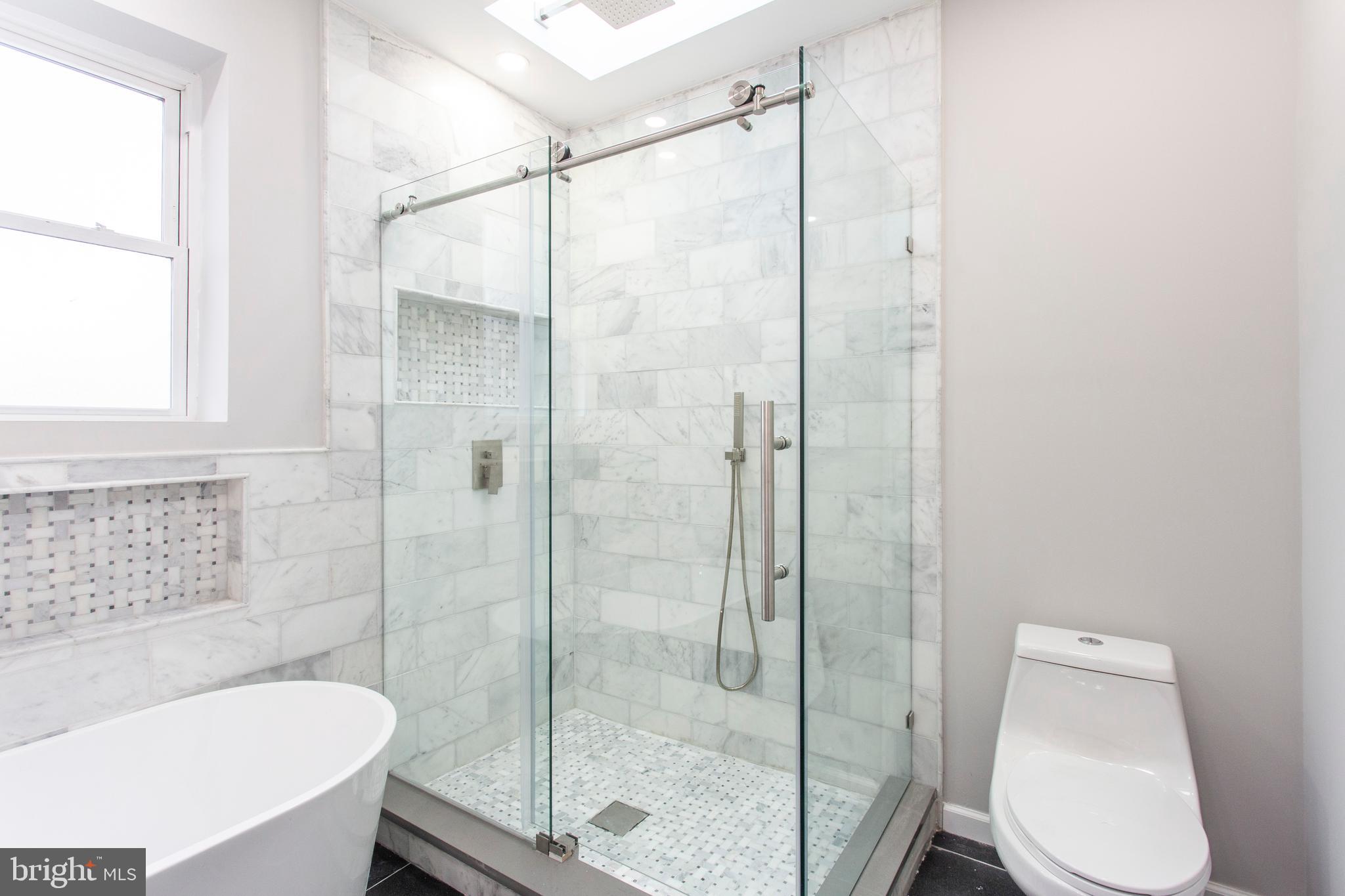 2214 Tasker Street Philadelphia, PA 19145 - Photo 22 of 33 Sliding glass doors in Shower.