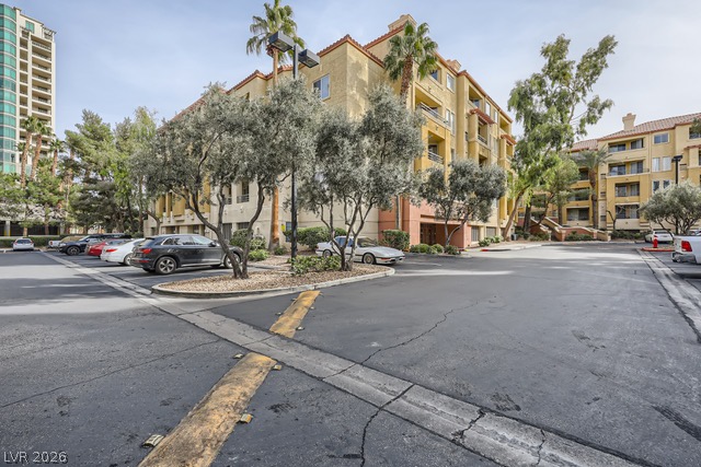 270 East Flamingo Road, Unit 315 Las Vegas, NV 89169 - Photo 1 of 11 A Mediterranean-inspired residential complex offers convenient surface parking and lush, mature landscaping.