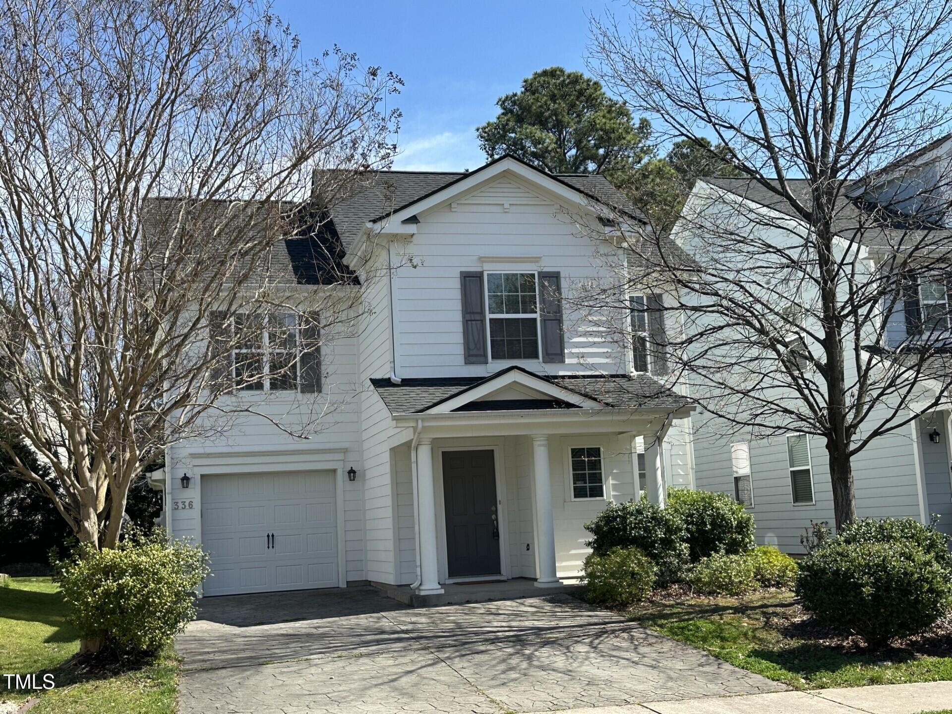 336 New Milford Road Cary, NC 27519 - Photo 1 of 53 a front view of a house with garden