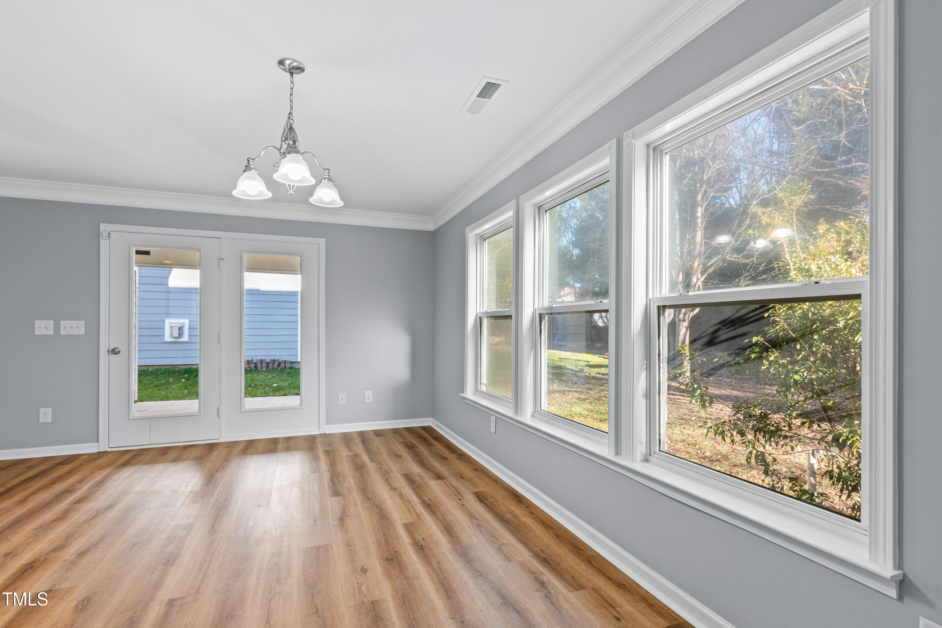 336 New Milford Road Cary, NC 27519 - Photo 18 of 53 a view of empty room with wooden floor and fan