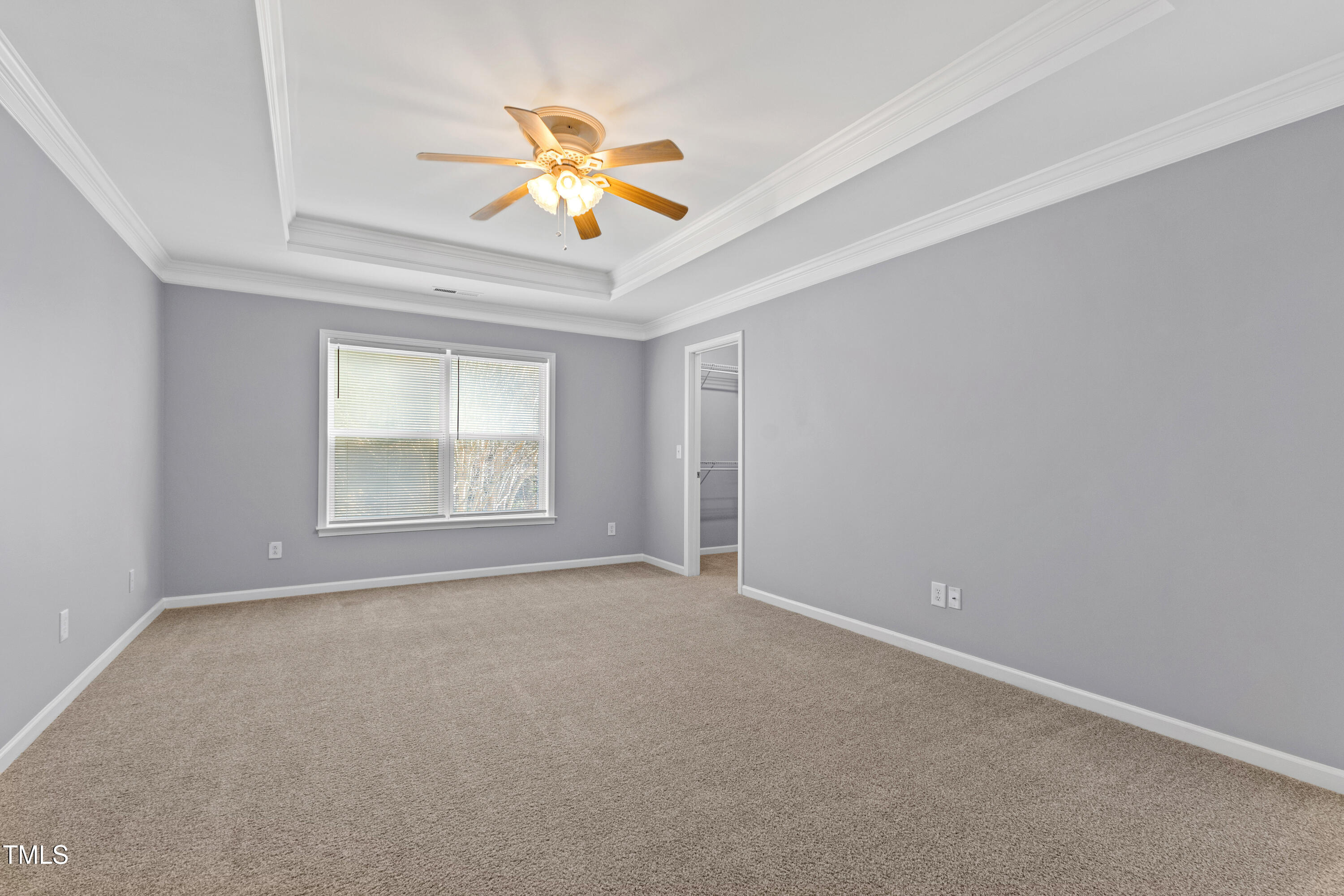 336 New Milford Road Cary, NC 27519 - Photo 24 of 53 an empty room with a window and chandelier fan
