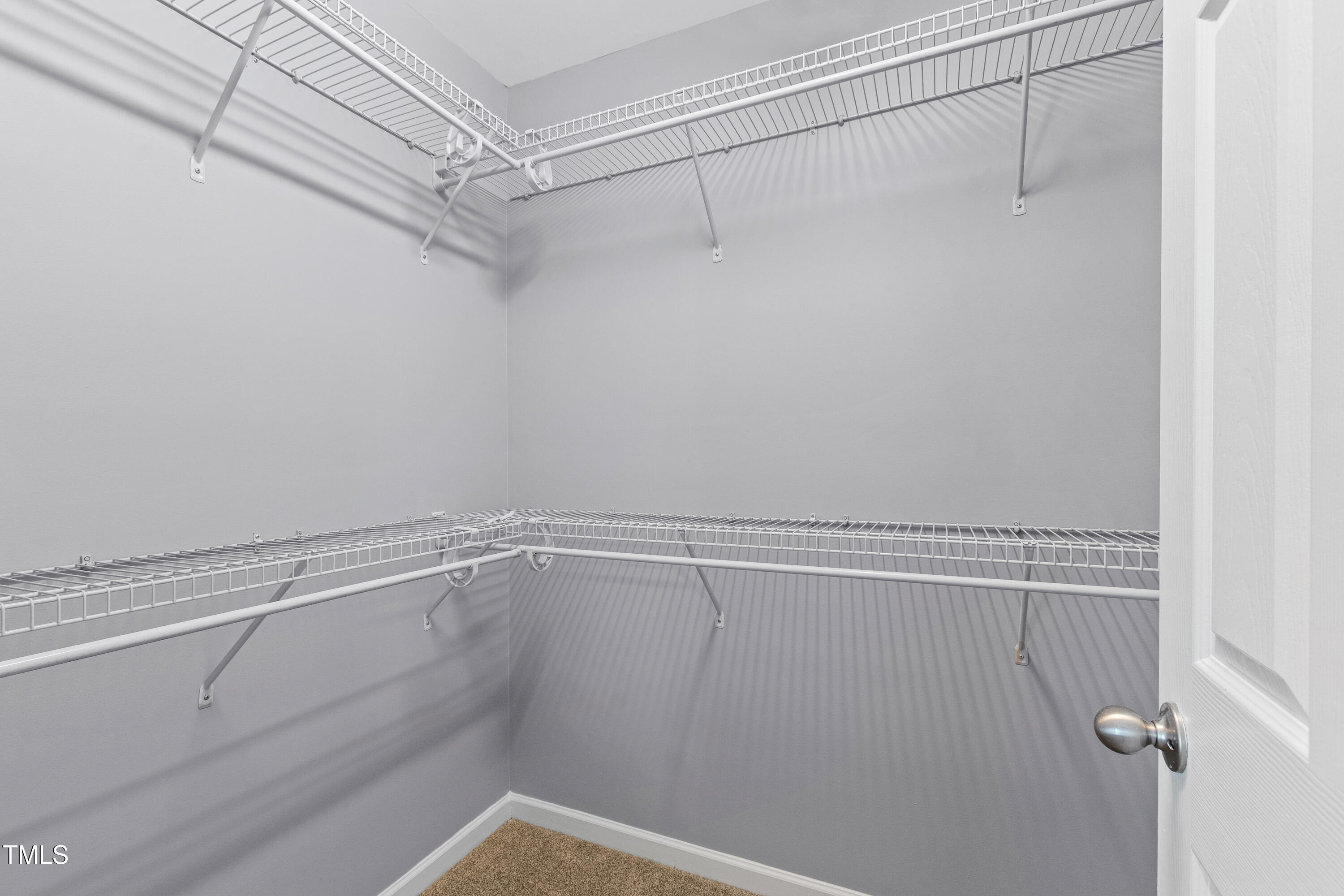 336 New Milford Road Cary, NC 27519 - Photo 26 of 53 a view of a room with racks on the wall