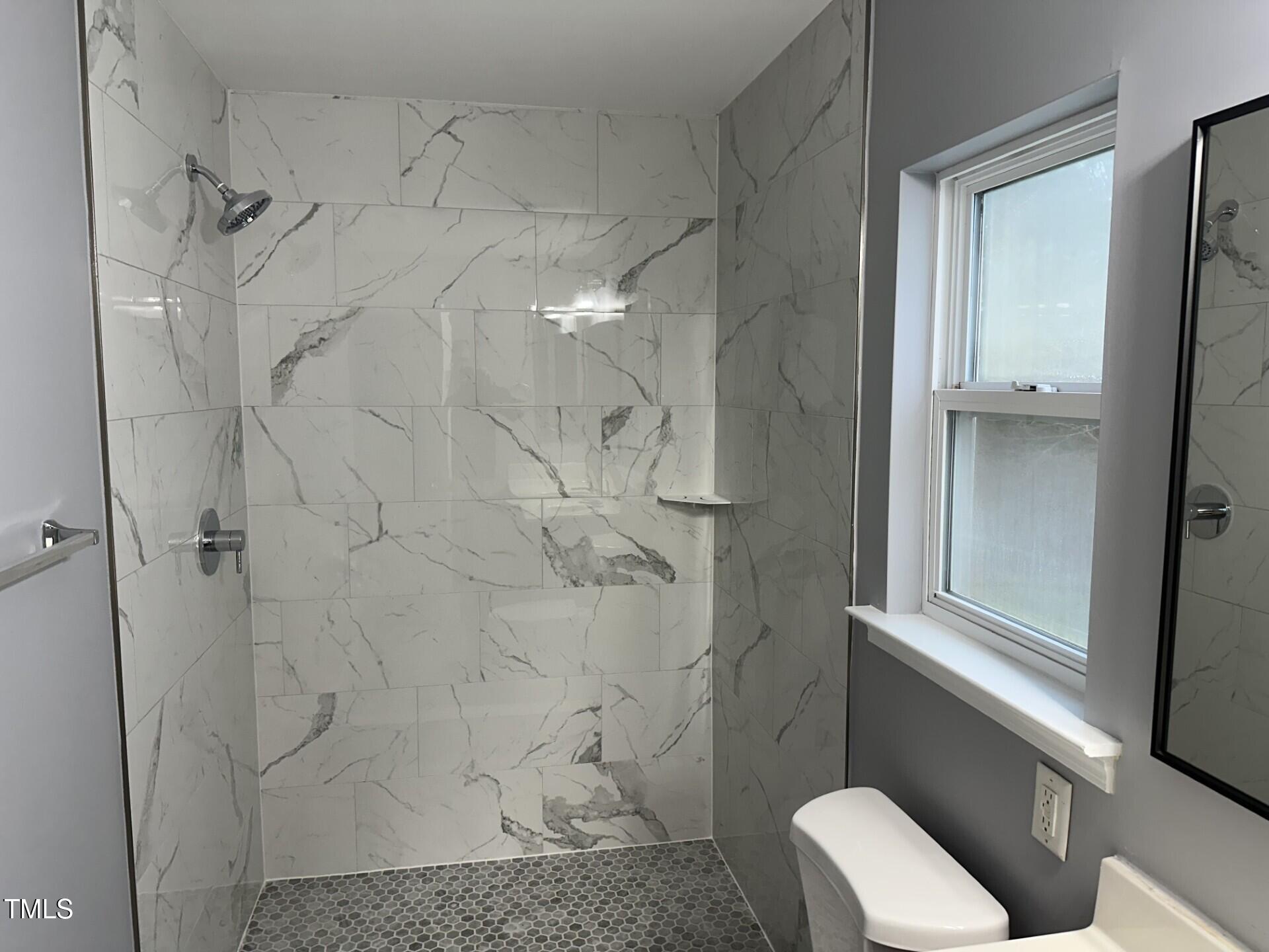 336 New Milford Road Cary, NC 27519 - Photo 29 of 53 a bathroom with a shower and toilet