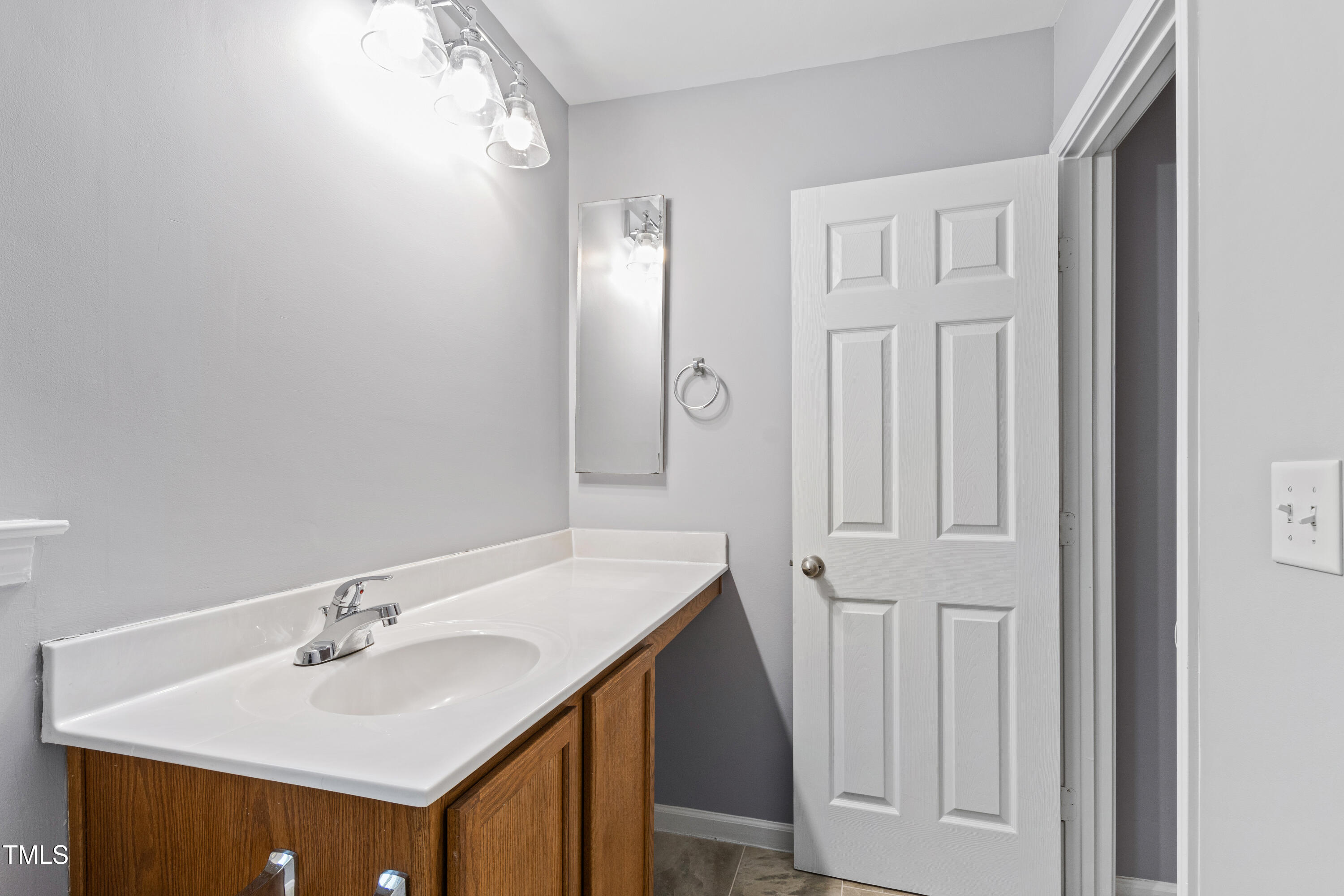 336 New Milford Road Cary, NC 27519 - Photo 30 of 53 a bathroom with a sink and a mirror