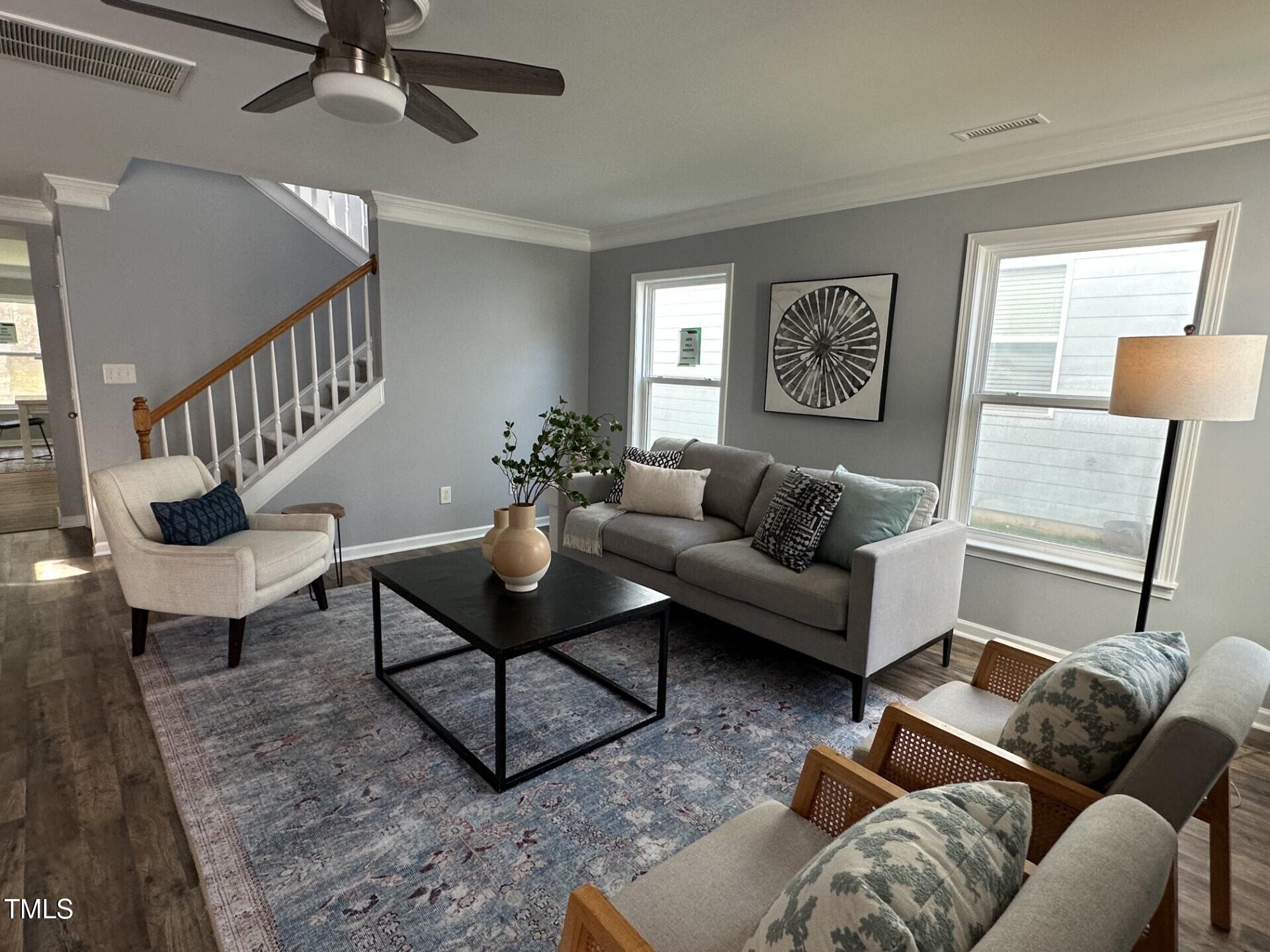 336 New Milford Road Cary, NC 27519 - Photo 3 of 53 a living room with furniture and a wooden floor