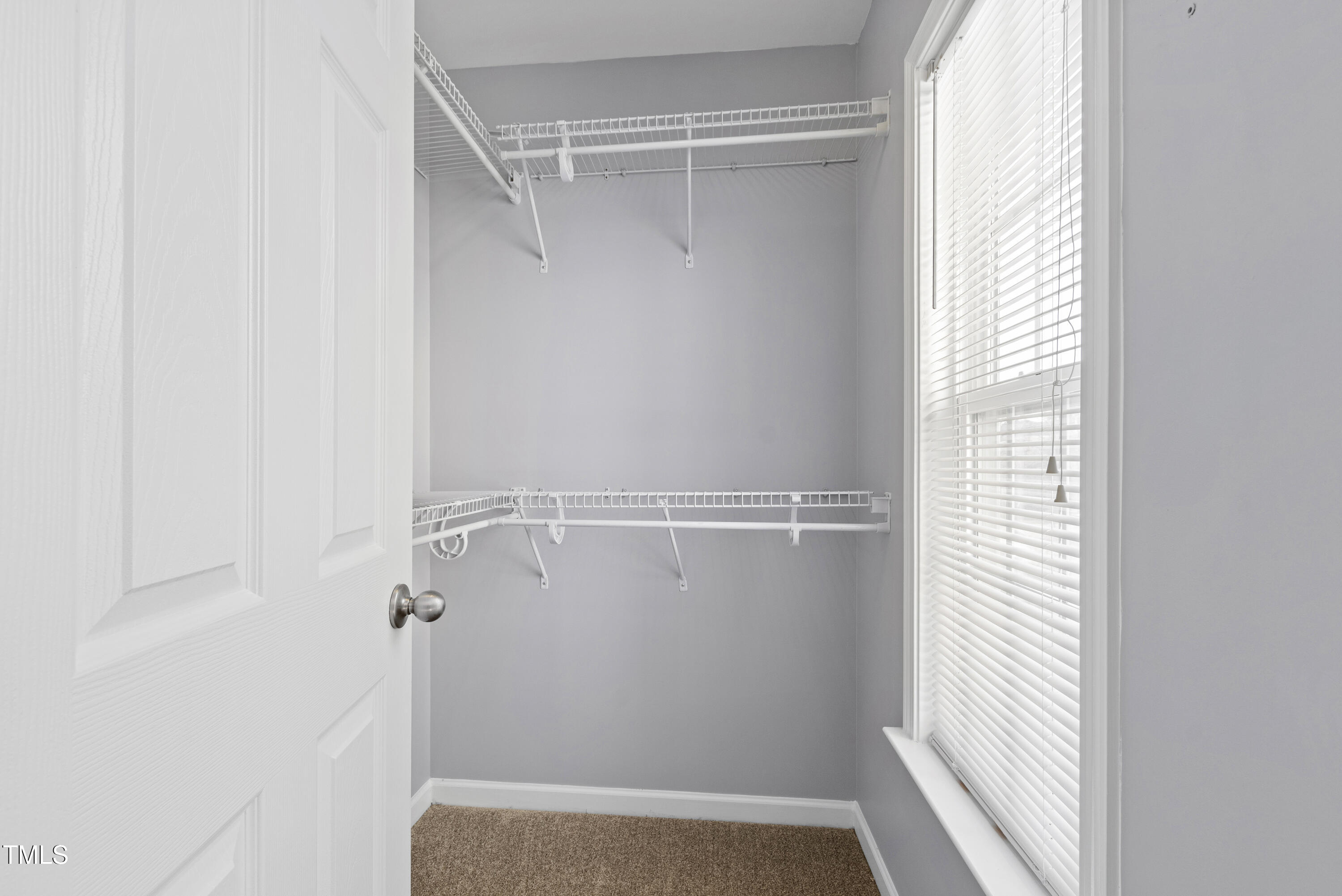 336 New Milford Road Cary, NC 27519 - Photo 35 of 53 a view of walk in closet with empty racks