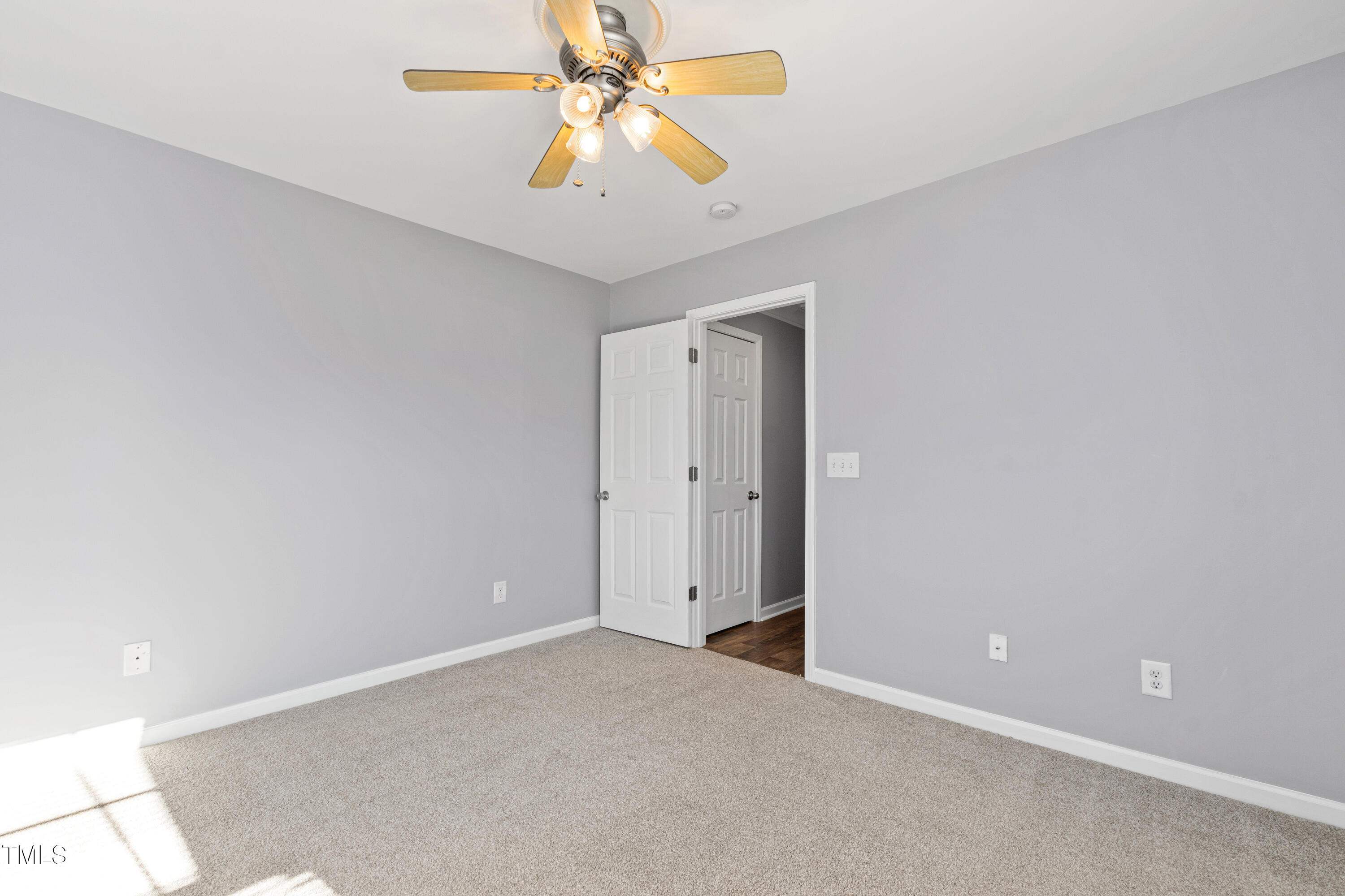 336 New Milford Road Cary, NC 27519 - Photo 37 of 53 an empty room with closet and a chandelier fan