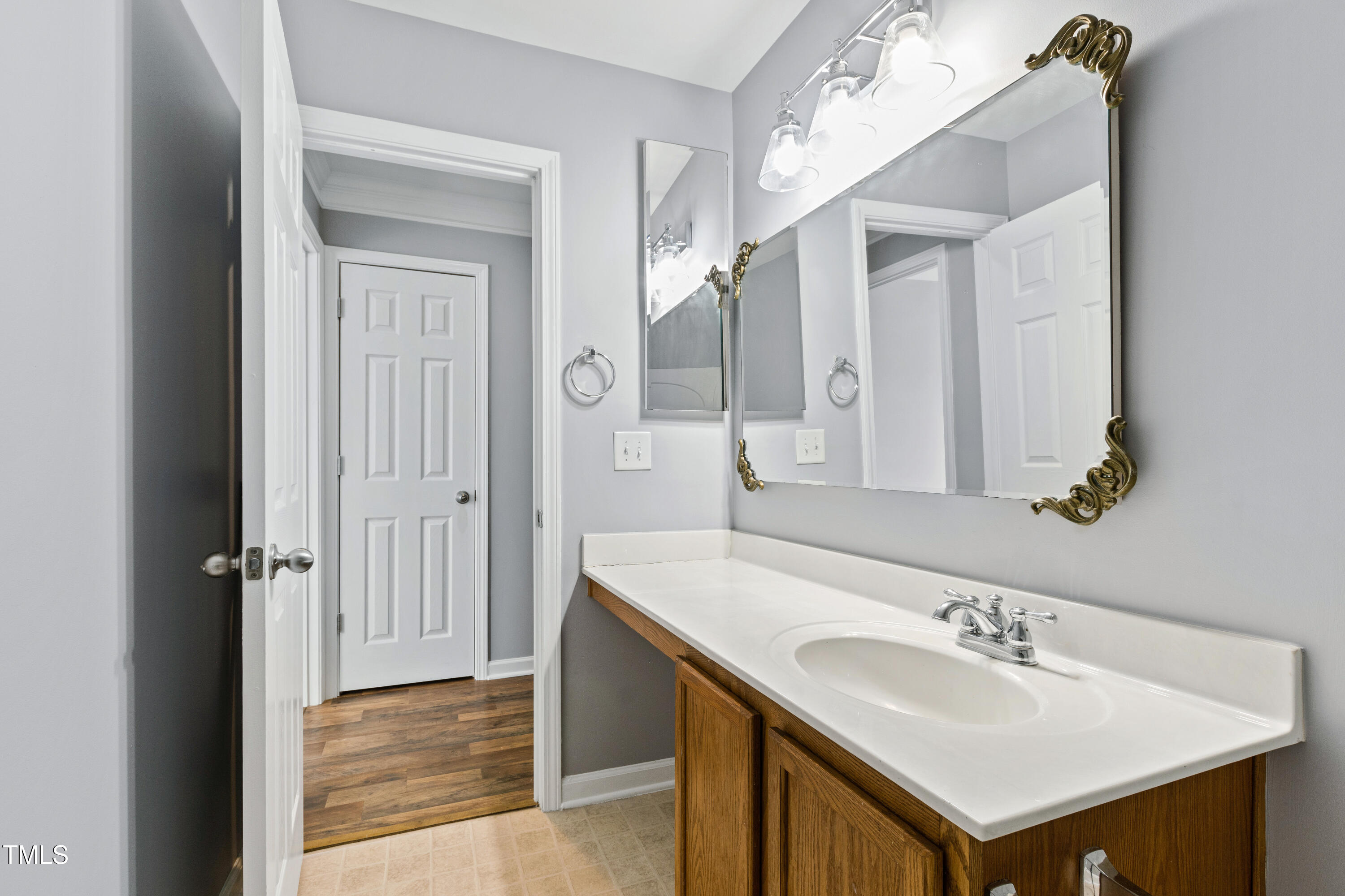 336 New Milford Road Cary, NC 27519 - Photo 38 of 53 a bathroom with a sink and a mirror