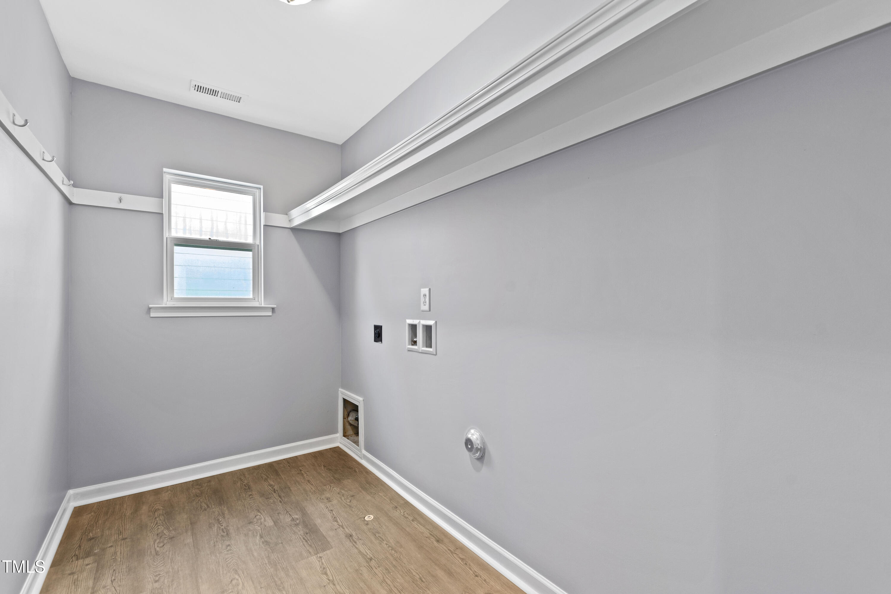 336 New Milford Road Cary, NC 27519 - Photo 40 of 53 a view of a small space with wooden floor and a window