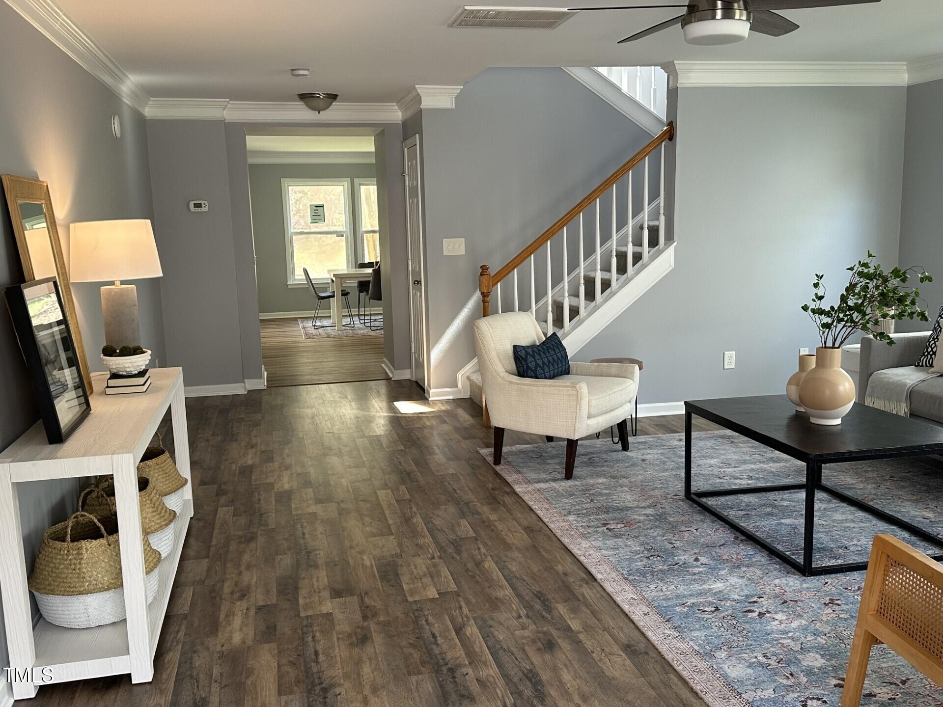 336 New Milford Road Cary, NC 27519 - Photo 4 of 53 a living room with furniture and a wooden floor