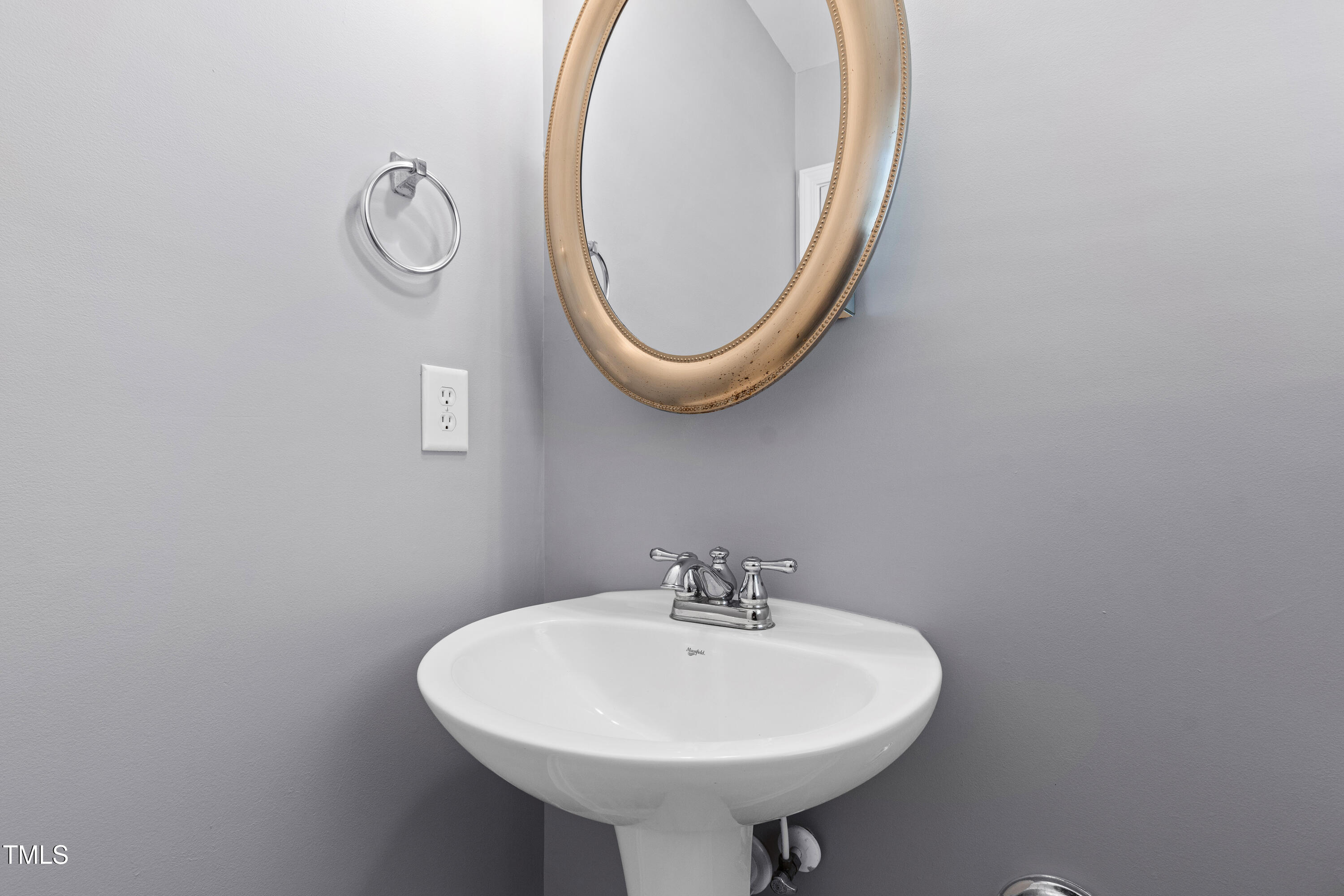 336 New Milford Road Cary, NC 27519 - Photo 41 of 53 a bathroom with a sink and a mirror