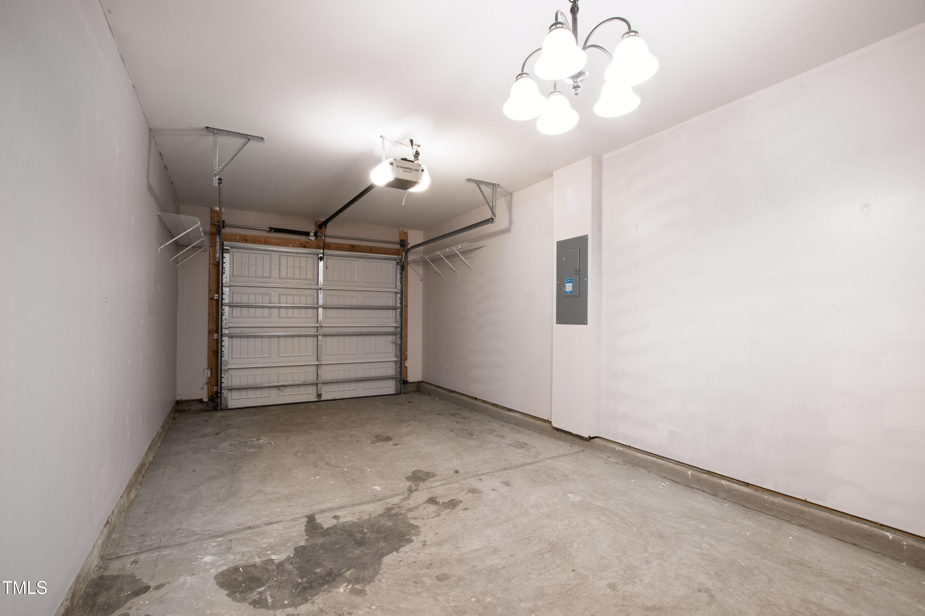 336 New Milford Road Cary, NC 27519 - Photo 42 of 53 an empty room with a chandelier fan and closet