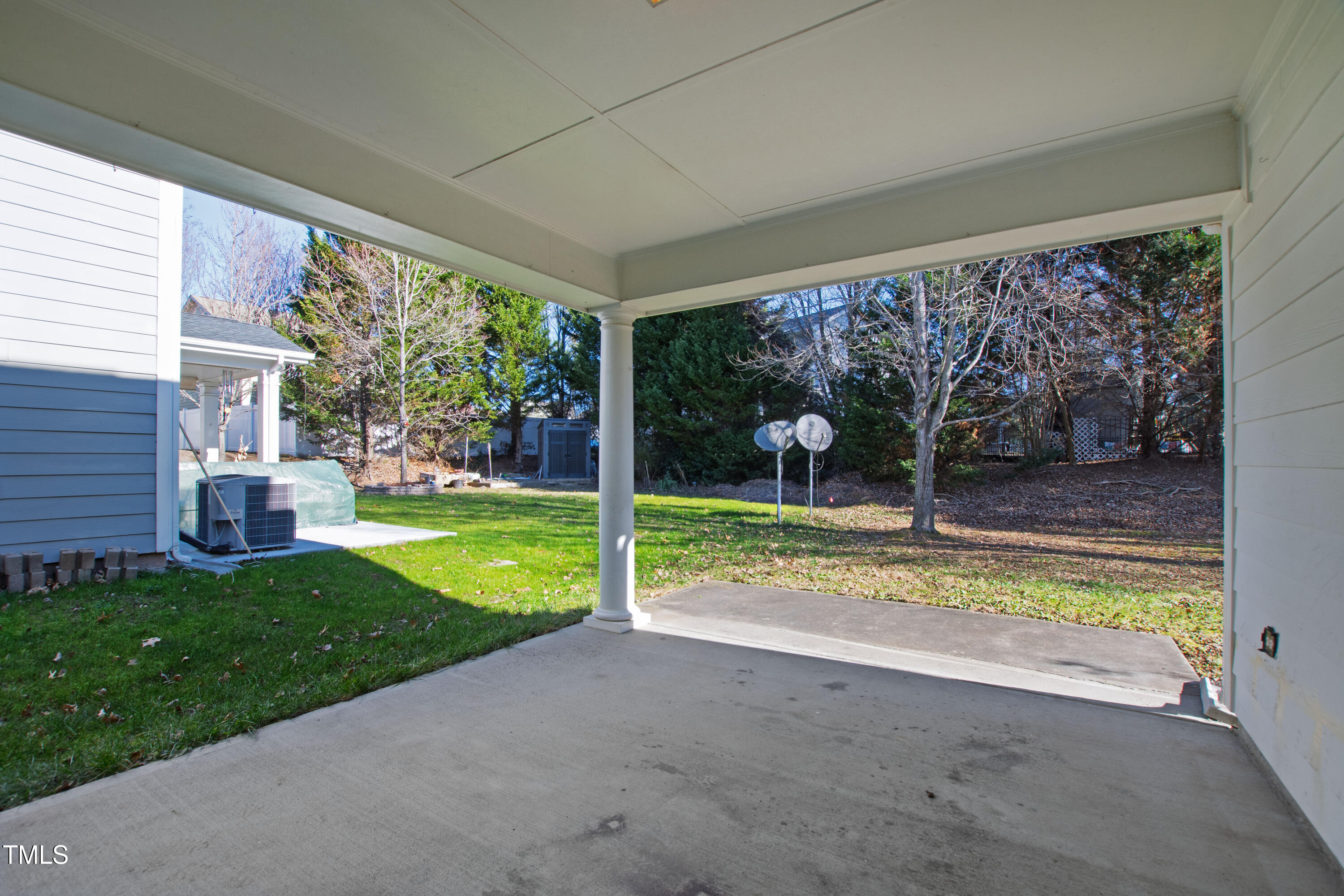 336 New Milford Road Cary, NC 27519 - Photo 43 of 53 a view of backyard with large windows and a large tree