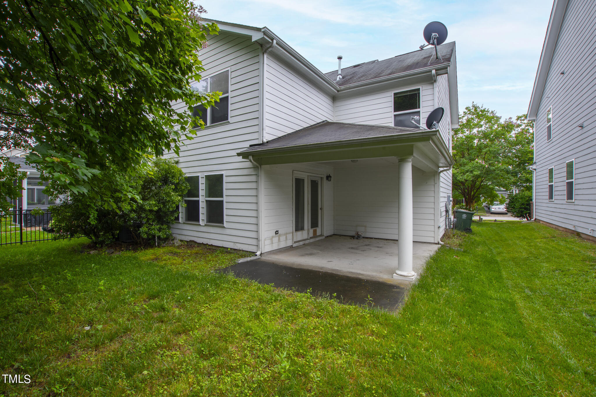 336 New Milford Road Cary, NC 27519 - Photo 45 of 53 a front view of a house with a yard and garage