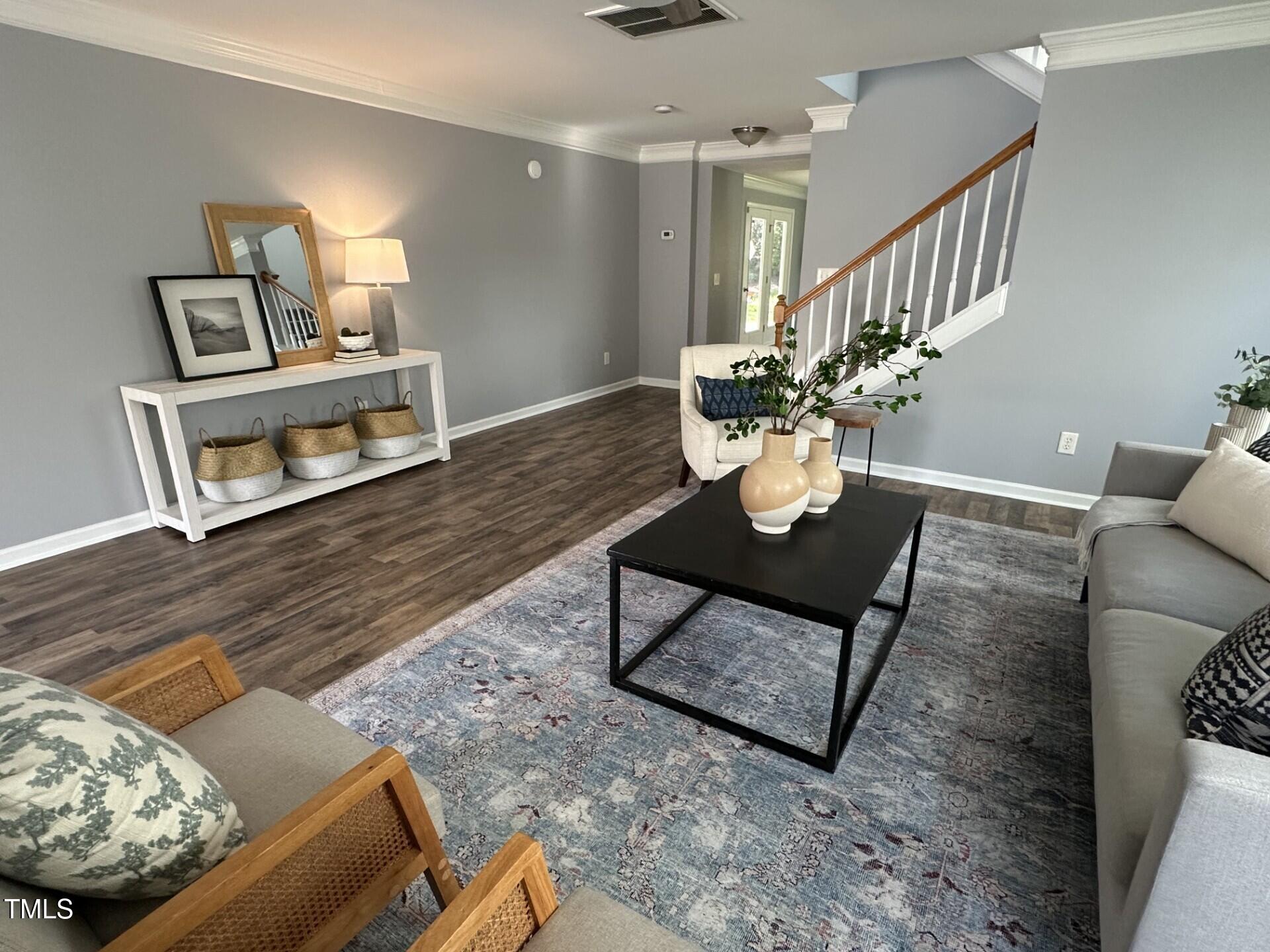 336 New Milford Road Cary, NC 27519 - Photo 5 of 53 a living room with furniture and a wooden floor