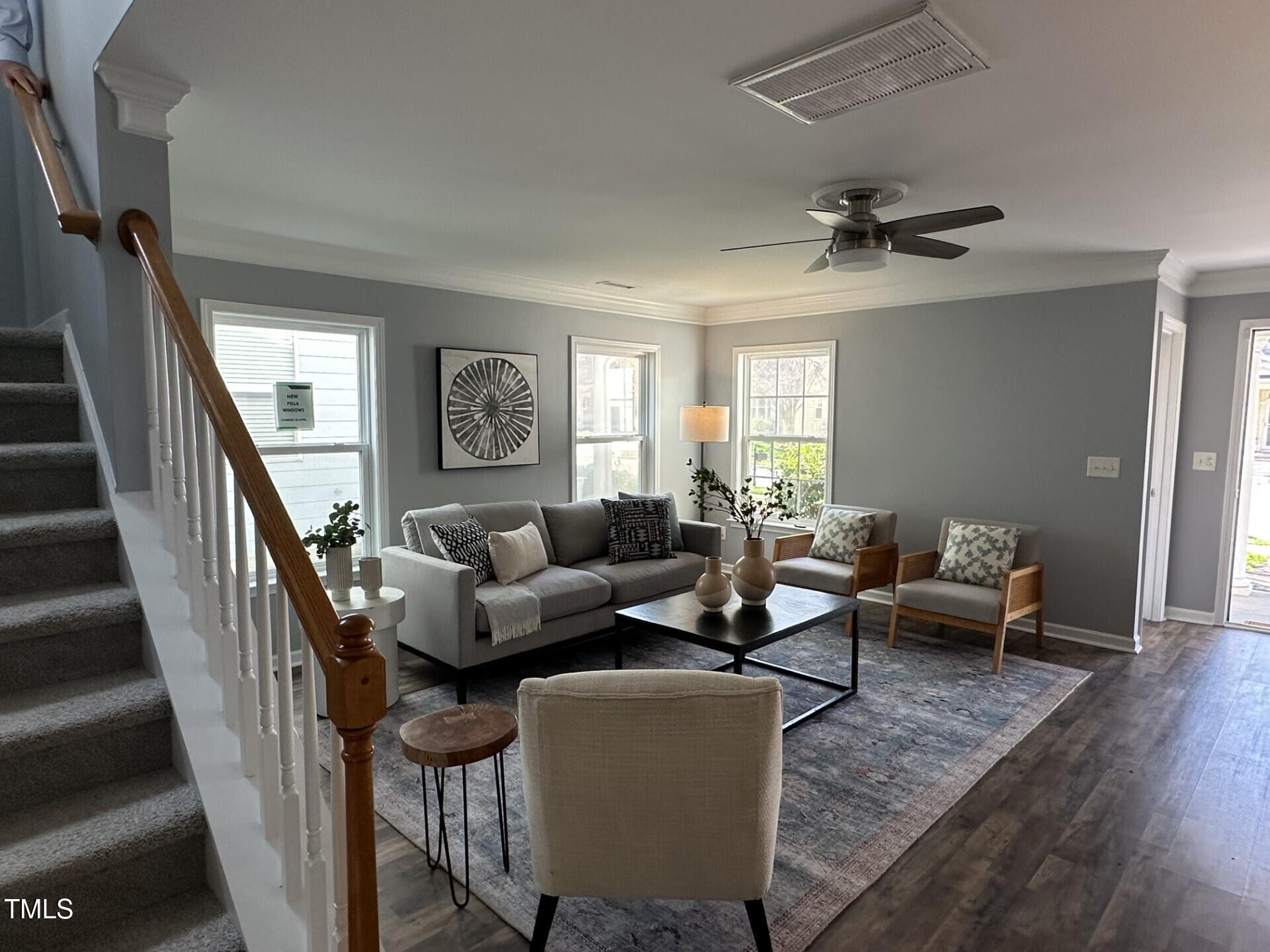 336 New Milford Road Cary, NC 27519 - Photo 6 of 53 a living room with furniture and a wooden floor