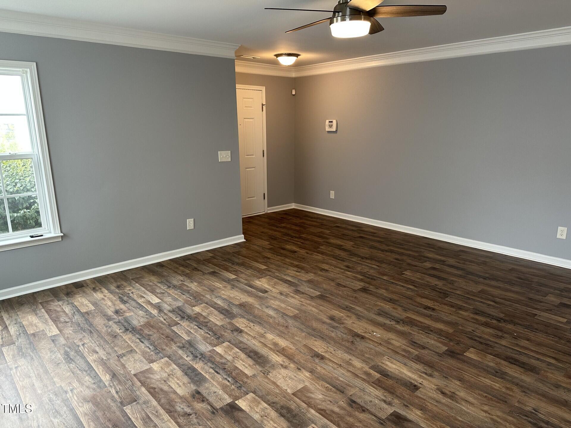 336 New Milford Road Cary, NC 27519 - Photo 7 of 53 wooden floor in an empty room with a window