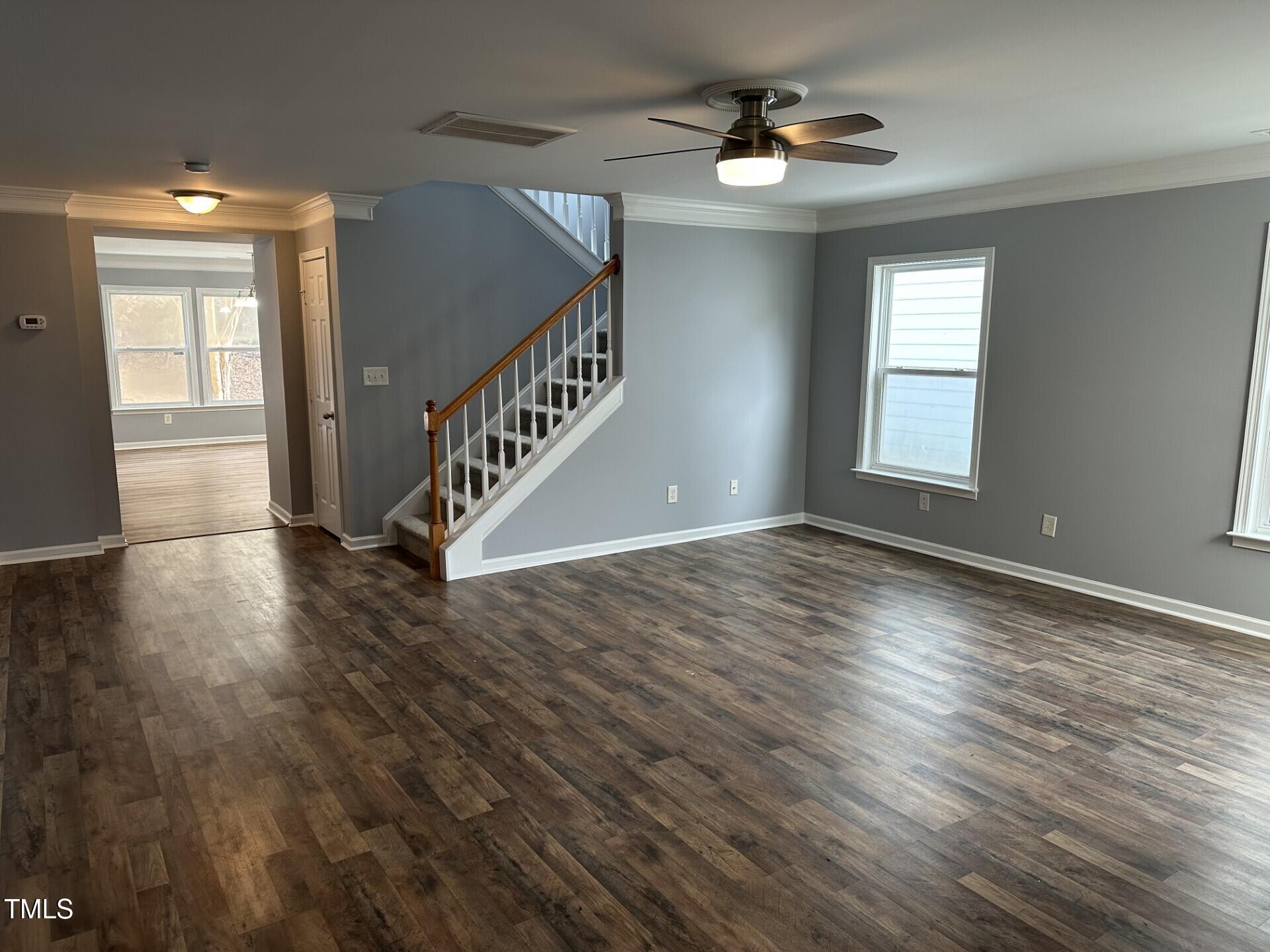 336 New Milford Road Cary, NC 27519 - Photo 9 of 53 a view of an empty room with wooden floor and a window
