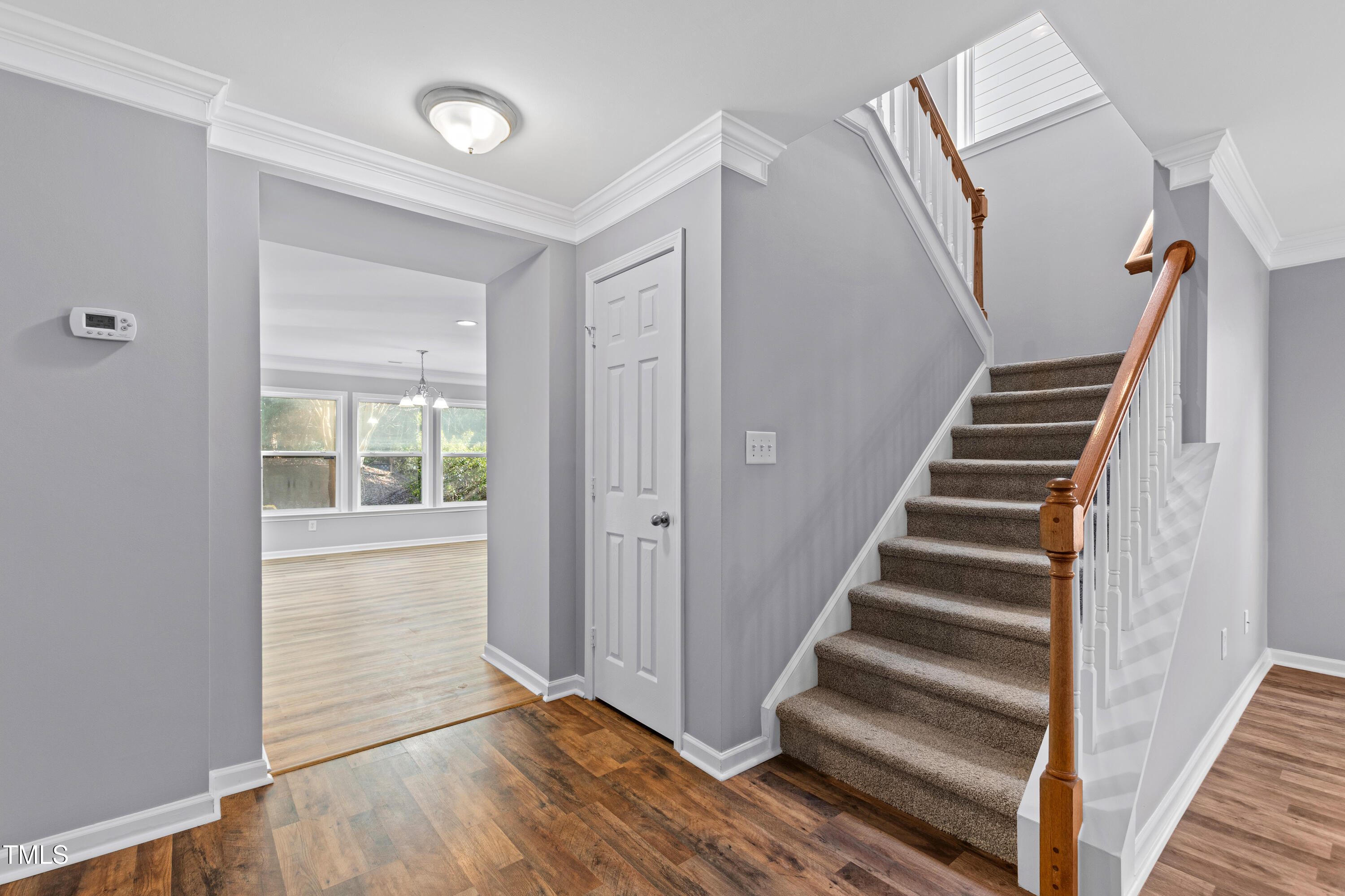 336 New Milford Road Cary, NC 27519 - Photo 10 of 53 a view of an entryway with wooden floor