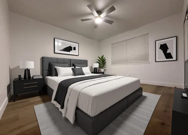 a bedroom with bed and night stand